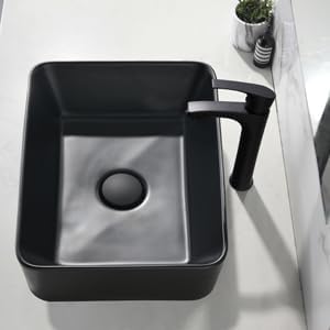 Lavatorio rectangular para baño con grifo y drenaje, color negro.